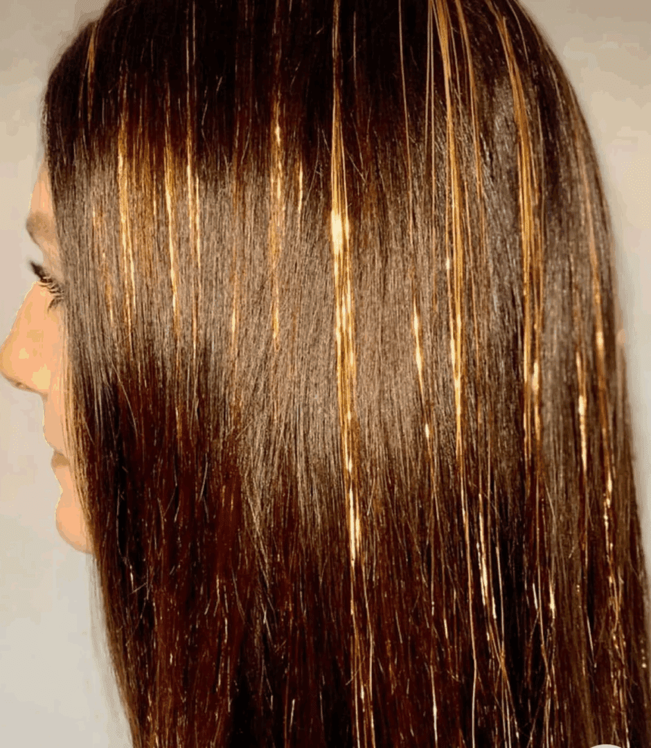 Shiny golden streaks in brown hair