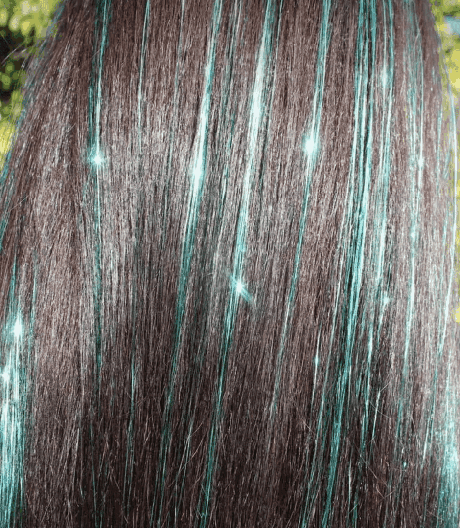 Long brown hair with teal streaks