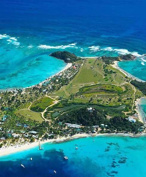 Lush green island in vibrant blue sea