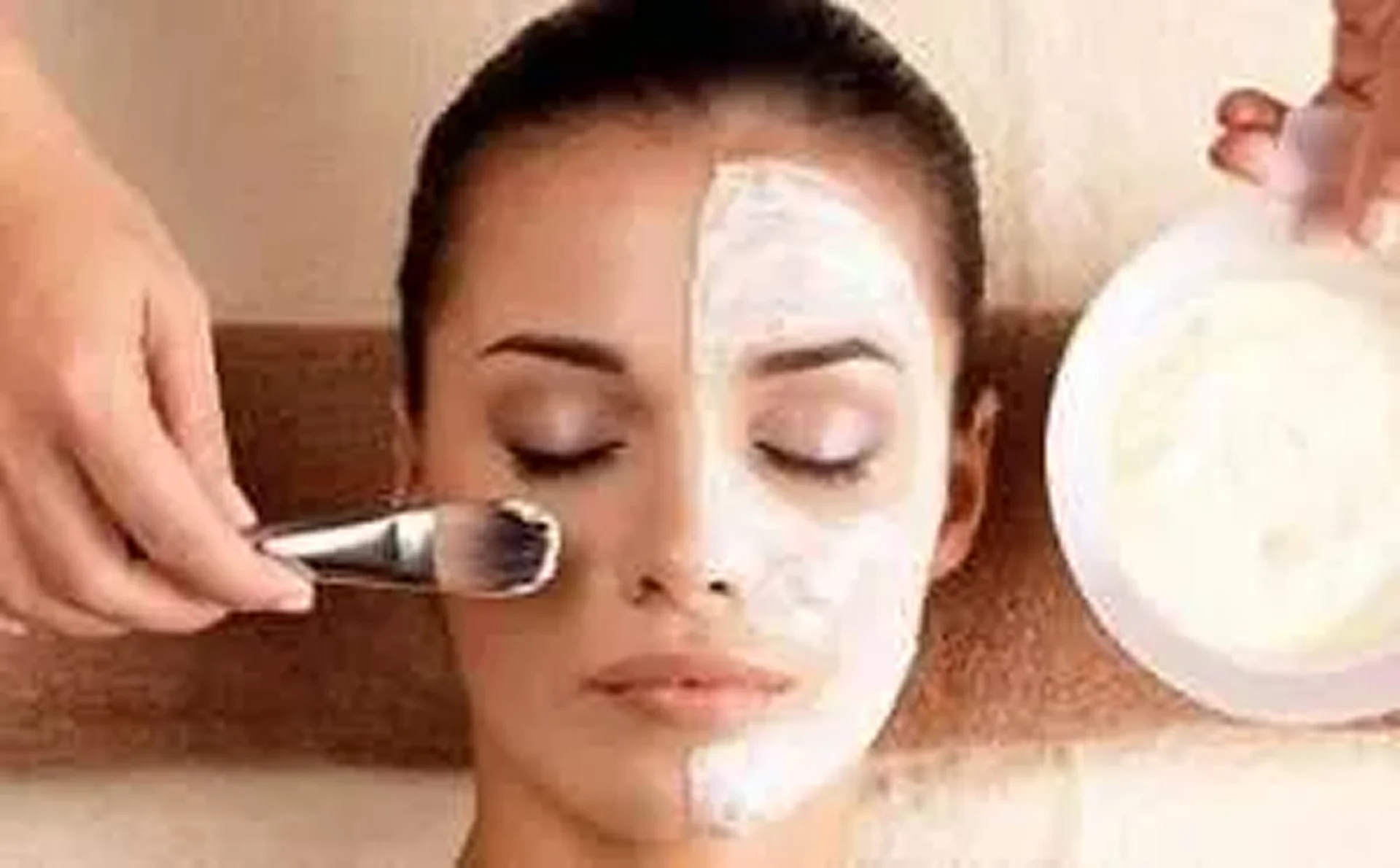 Woman receiving facial treatment
