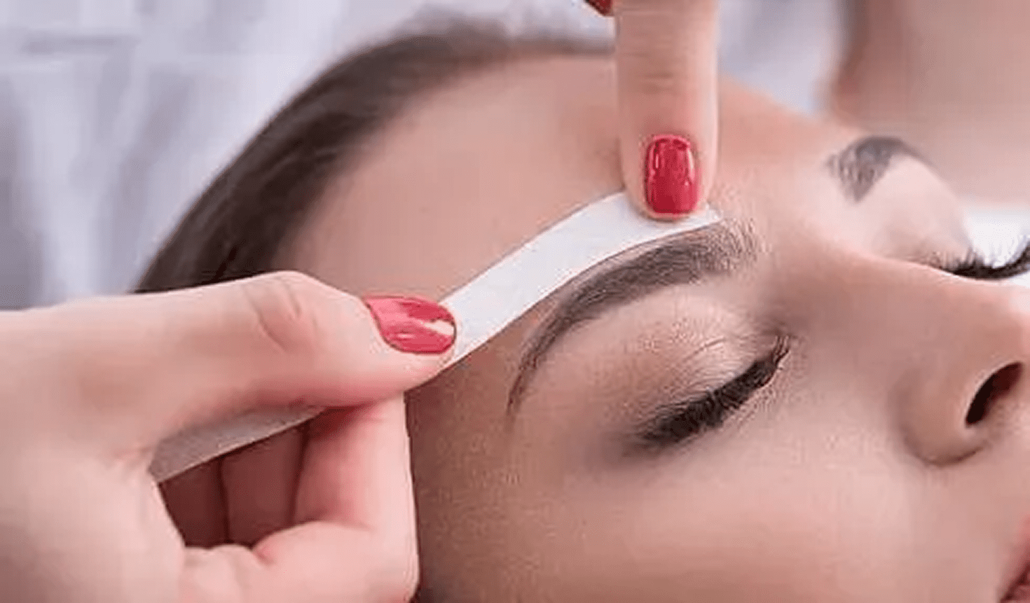 Woman getting eyebrows waxed