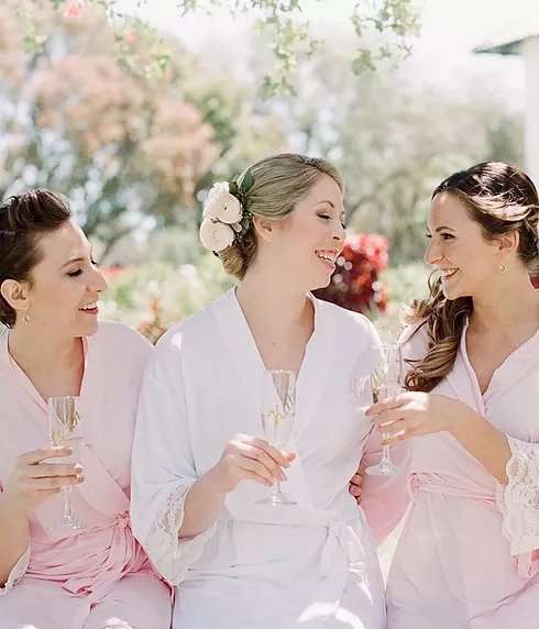 Friends celebrating with drinks outdoors