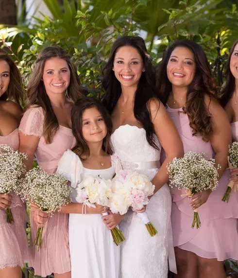 Smiling bridal party in pink dresses