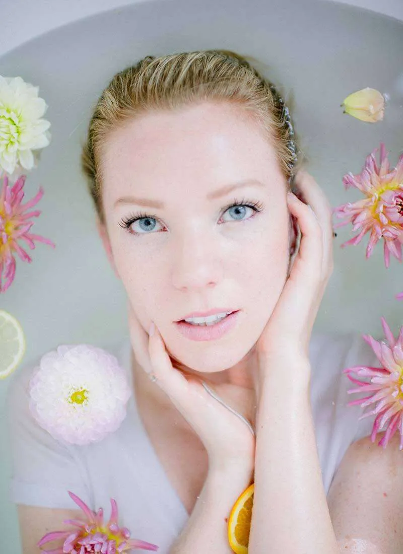 Relaxing bath with flowers and citrus