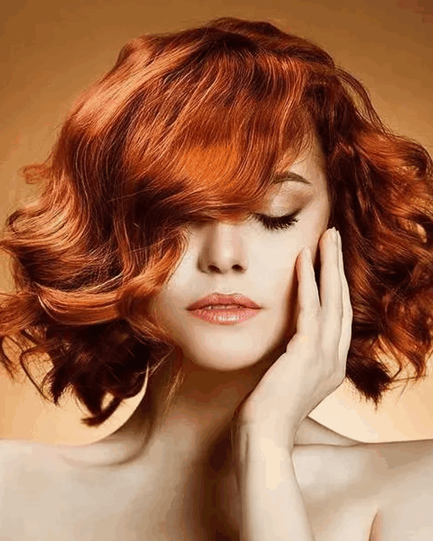 Woman with vibrant red curly hair