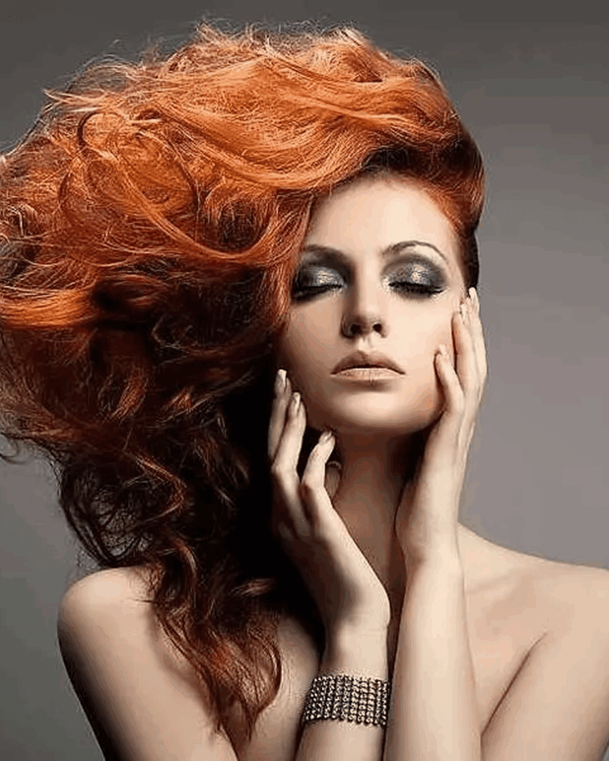 Red-haired woman with dramatic hairstyle